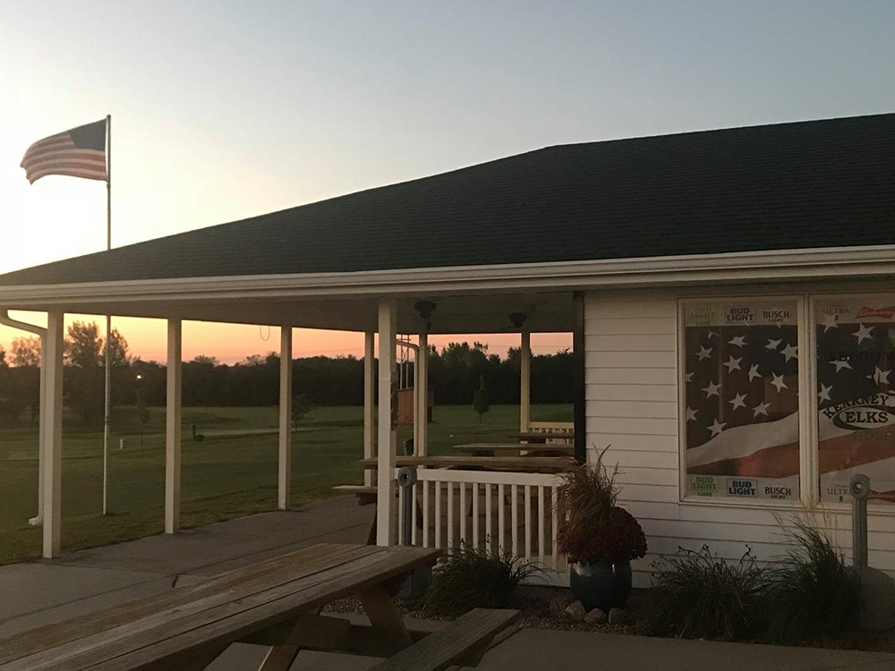 view of clubhouse with flag